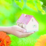casa-mano-flores Miniatura